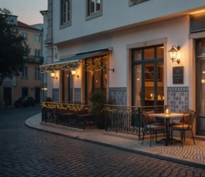 Editorial view of Mesae Baralho restaurant at dusk, with an elegant dining room and tables set.